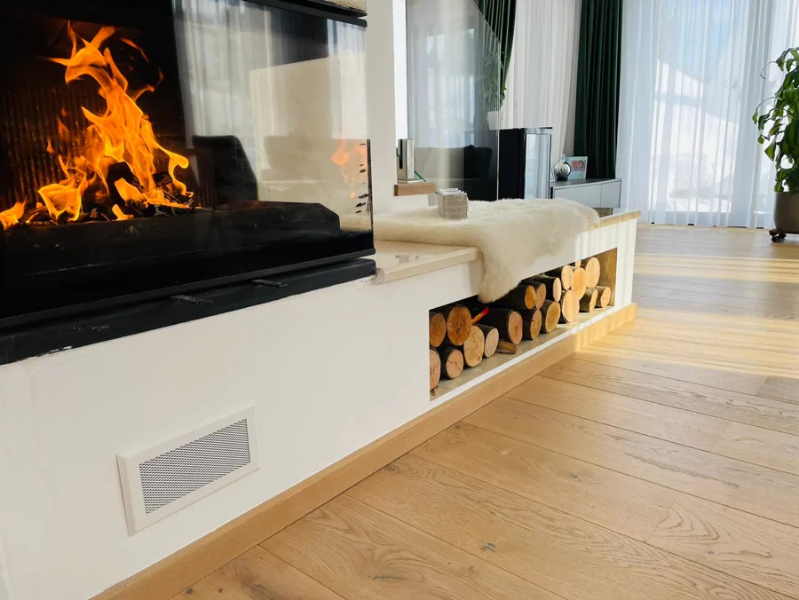 Fireplace with burning logs — warm atmosphere on a winter evening